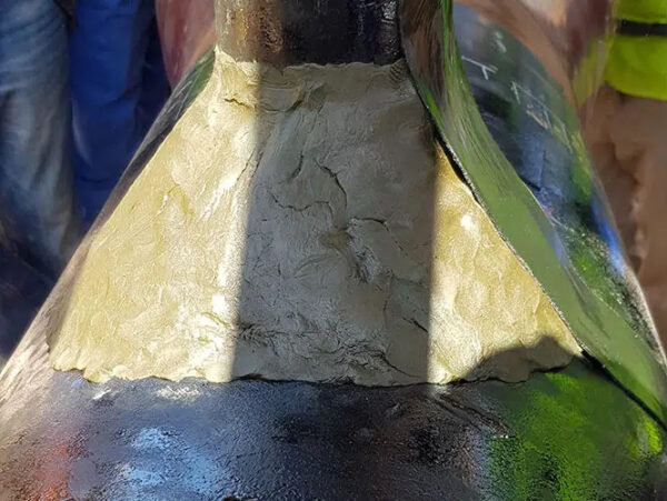Denso Densyl Mastic 18kg applied around the base of a pipe