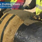 Denso Profiling Mastic 1.75kg being applied onto a pipe