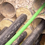 Densoseal 16A being applied around enclosed rebar