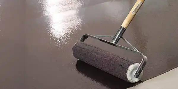 Roller painting a floor
